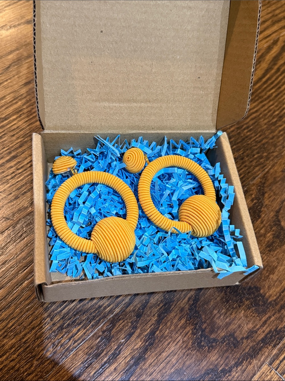 Handmade La La Hoop Drop Earrings in tangerine orange/yellow wrapped silk cord